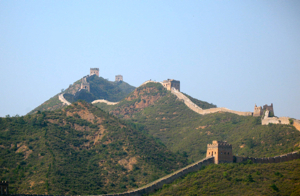 Great Wall of China snaking on the tops of the hills