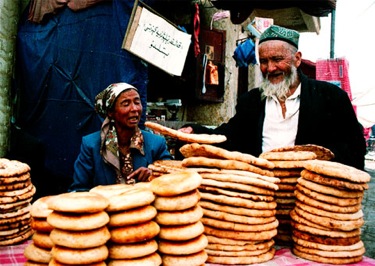 Silk Road market couple selling flat bread 