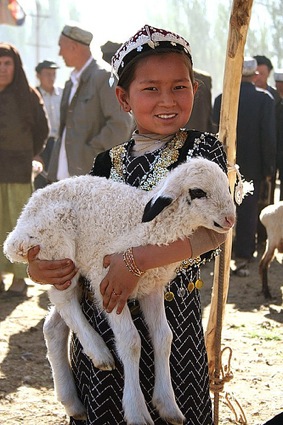 Child on Silk Road holding a goat